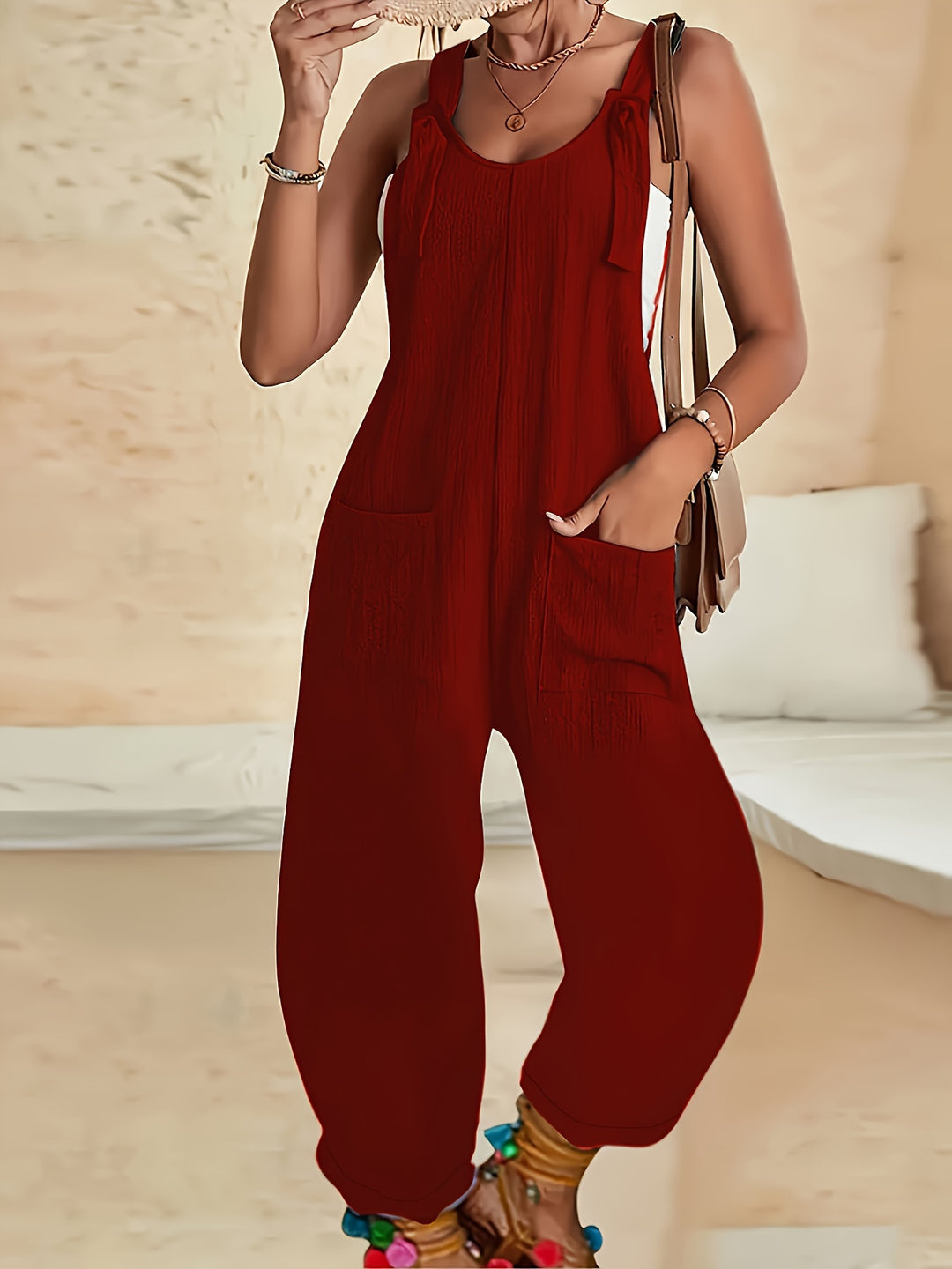 Casual jumpsuit with textured weave and knotted detail