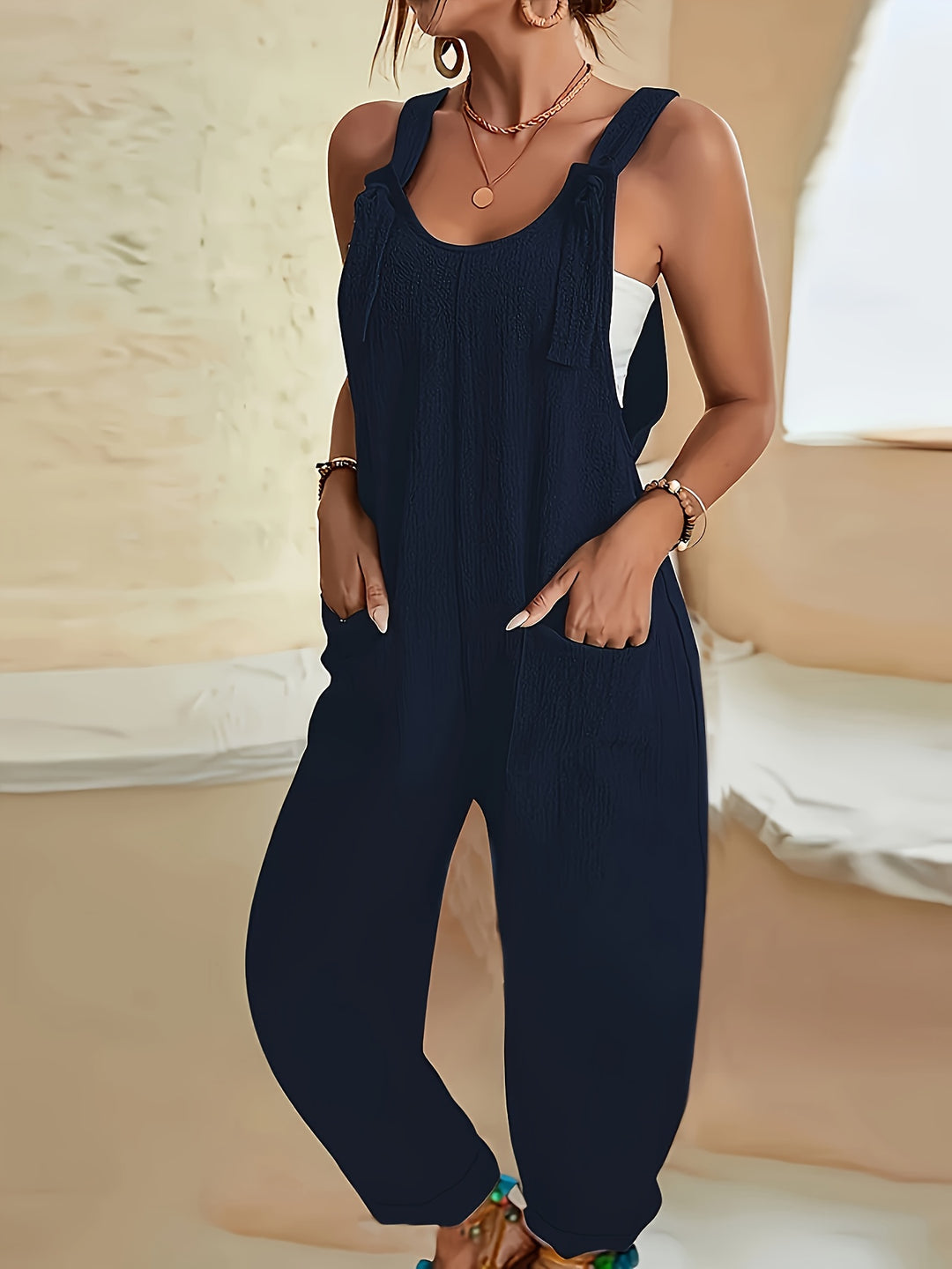 Casual jumpsuit with textured weave and knotted detail